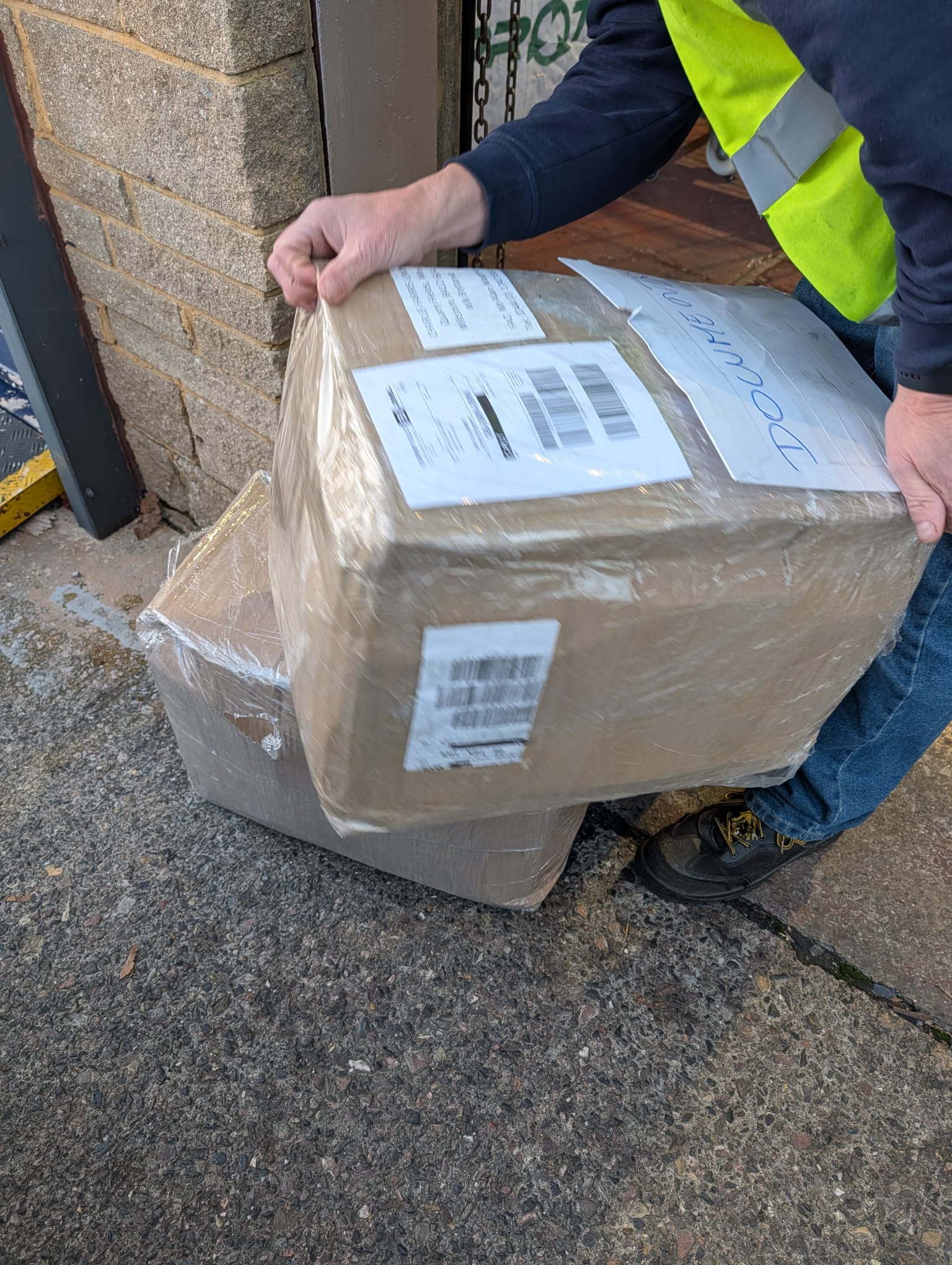 Emerald Logistics delivery professional handling package